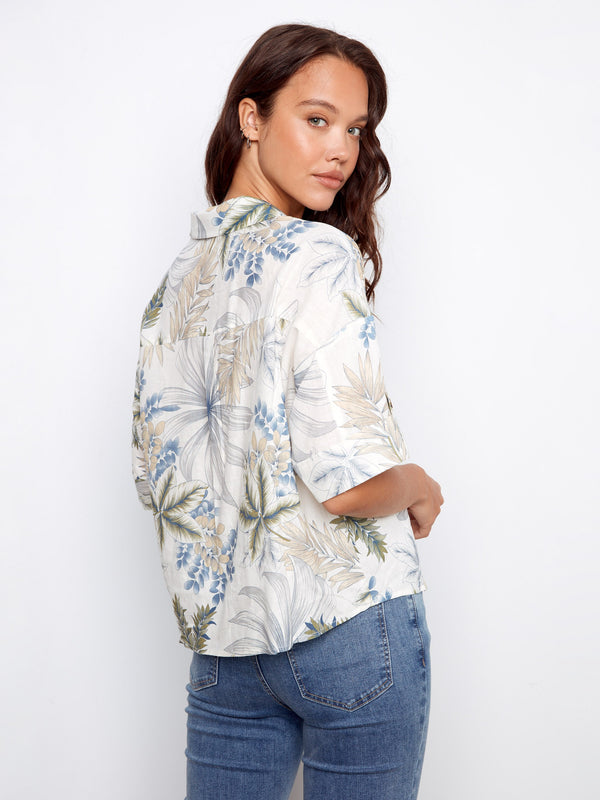 Chic button-front blouse adorned with vibrant floral prints and chest pockets, ideal for adding some color to your wardrobe by Charlie B.