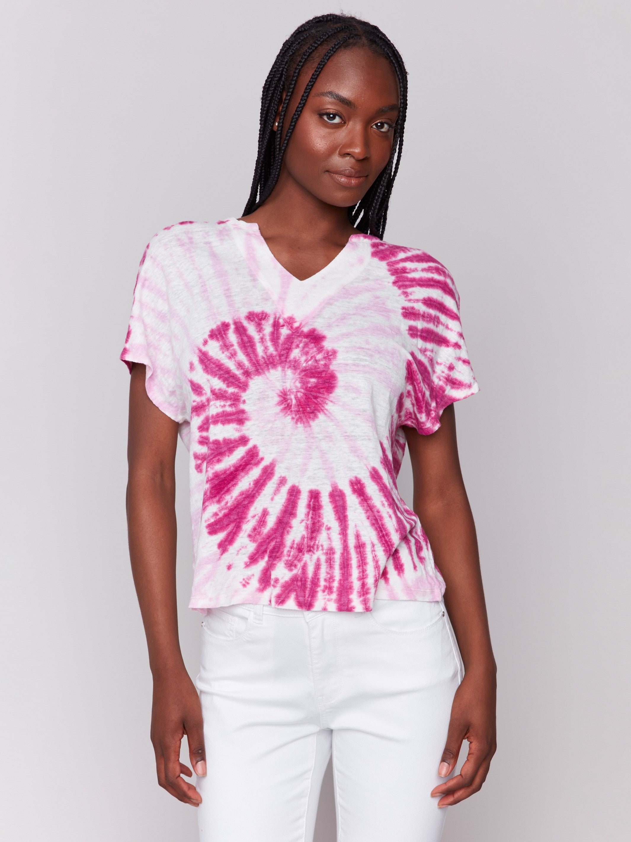Pink dolman top with a split neckline, showcasing its short sleeves by Charlie B.