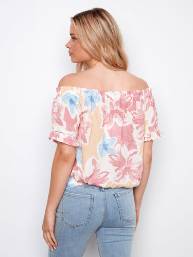 The elastic hem of this top provides a snug fit while maintaining style and comfort by Charlie B.