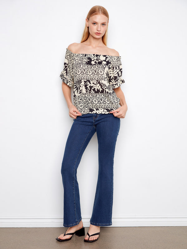 Effortlessly stylish with its elastic hem and detailed print, this top is ideal for both day and night looks by Charlie B.