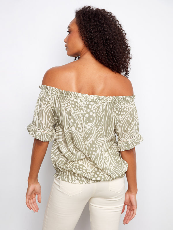 The elastic hem on this top provides comfort and style, making it ideal for casual outings. By Charlie B.