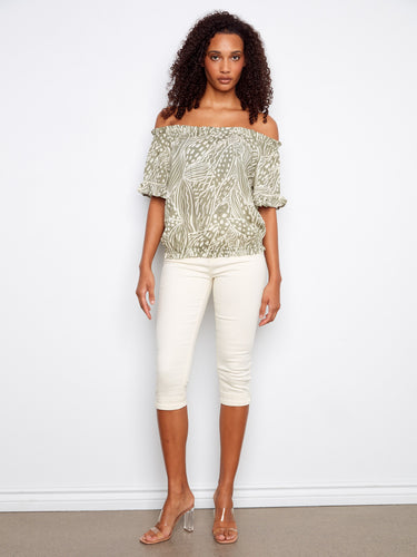 A beautifully patterned off-the-shoulder top with charming flutter sleeves for added flair. By Charlie B.