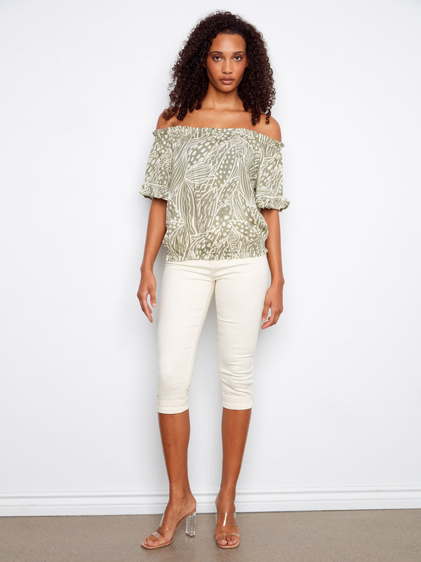 A beautifully patterned off-the-shoulder top with charming flutter sleeves for added flair. By Charlie B.