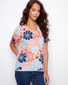 Vibrant floral print t-shirt featuring a stylish V-neckline and folded cuff design, perfect for casual outings by Charlie B.