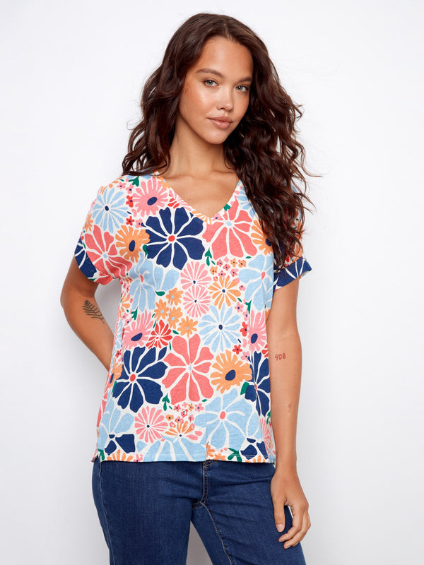 Vibrant floral print t-shirt featuring a stylish V-neckline and folded cuff design, perfect for casual outings by Charlie B.