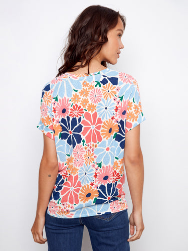 Colorful floral print tee in a breathable linen blend with elegant short dolman sleeves for everyday wear by Charlie B.