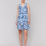 Knee length blue and white ikat print dress with a waist drawstring by Charlie B.