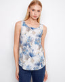 Floral top with a scoop neckline, showcasing a delicate sleeveless design perfect for warm weather. Crafted by Charlie B.