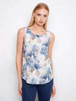 Floral top with a scoop neckline, showcasing a delicate sleeveless design perfect for warm weather. Crafted by Charlie B.