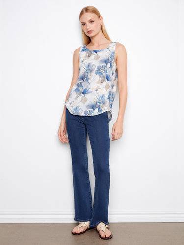 Elegant floral top featuring a rounded hem, adding a graceful touch to any casual outfit. Designed by Charlie B.