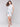 Knee-length sleeveless dress featuring a vibrant floral pattern by Charlie B.
