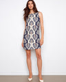Elegant dress with a crew neckline, showcasing a bold pattern and crafted for comfort. Perfect for any occasion by Charlie B.