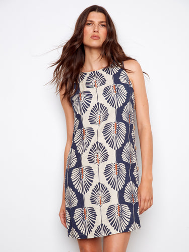 Stylish knee-length dress featuring side button detail, offering a unique flair to your wardrobe essentials by Charlie B.