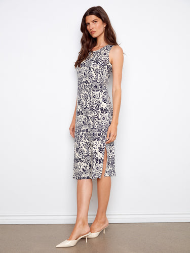 This fashionable dress combines a scoop neckline with intricate detailing, making it a versatile choice. By Charlie B.