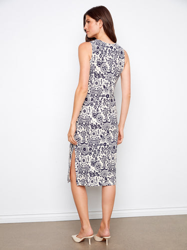 Graceful sleeveless design with side slits enhances the flowy silhouette of this elegant dress. By Charlie B.