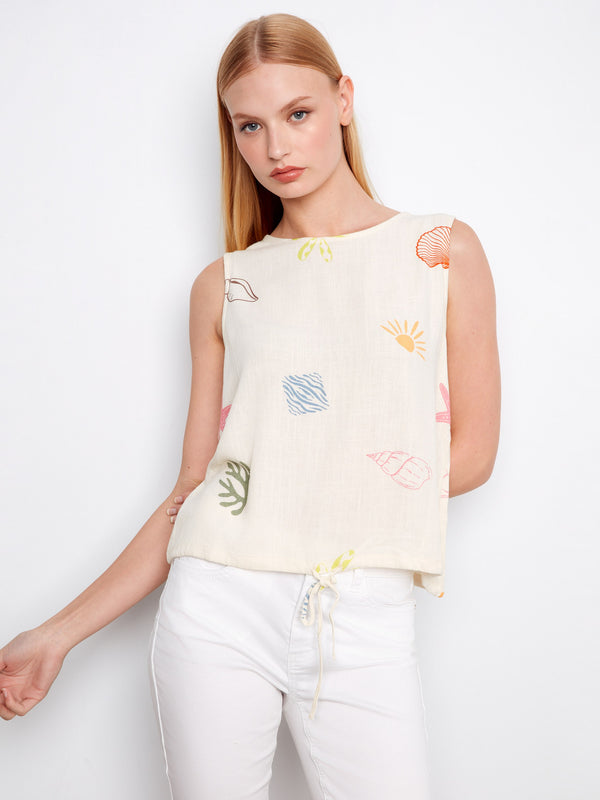 Featuring an eye-catching ocean print, this sleeveless linen top offers both style and comfort by Charlie B.