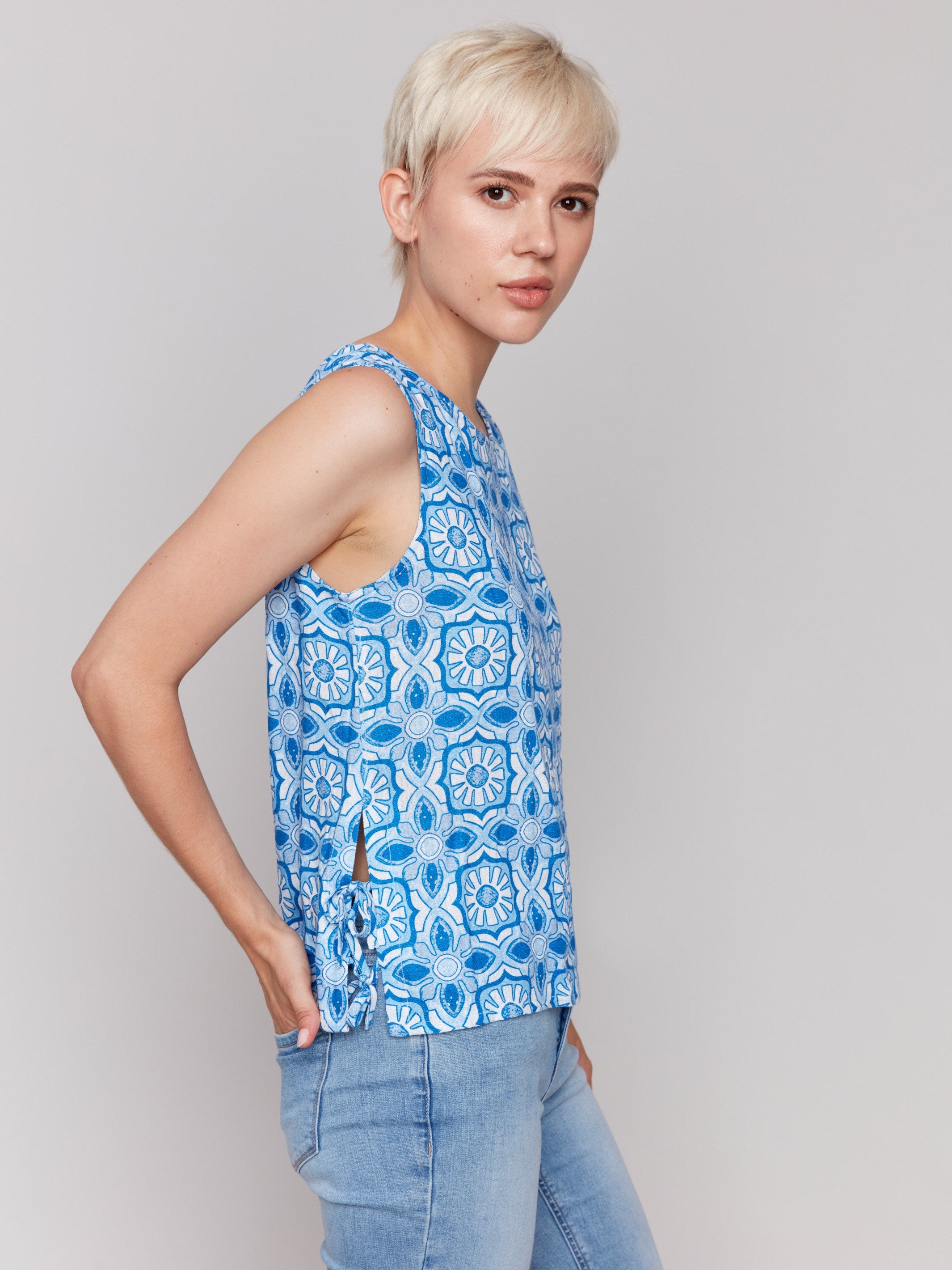 Artistic sleeveless design featuring an illusion print by Charlie B.