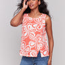 Coral top featuring a crew neckline with abstract print by Charlie B.
