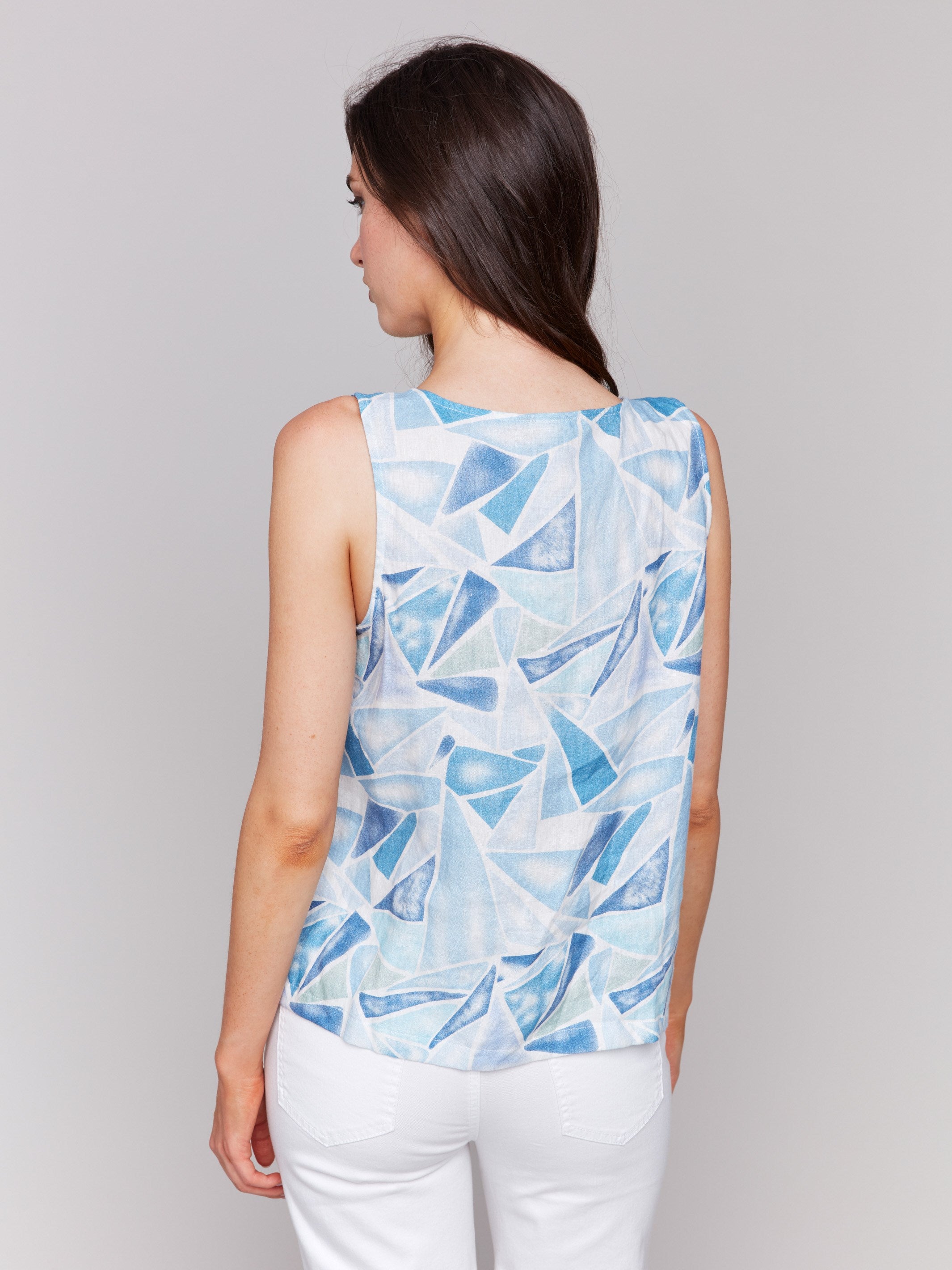 Denim top with slit at hem and abstract design by Charlie B.