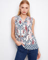 Abstract print top with a sleeveless design and a ruffle neckline, adding elegance to any outfit by Charlie B.