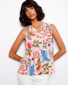 Floral blouse with a V-neck, showcasing a vibrant pattern of pink and blue flowers. Perfect for summer outings by Charlie B.