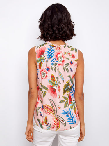Elegant V-neck blouse decorated with vivid blooms, adding a touch of sophistication to any outfit by Charlie B.