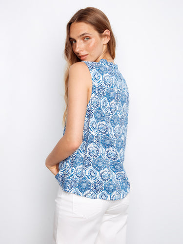 A charming addition to any wardrobe, this piece highlights a delicate ruffled neckline in bold blue hues. By Charlie B.