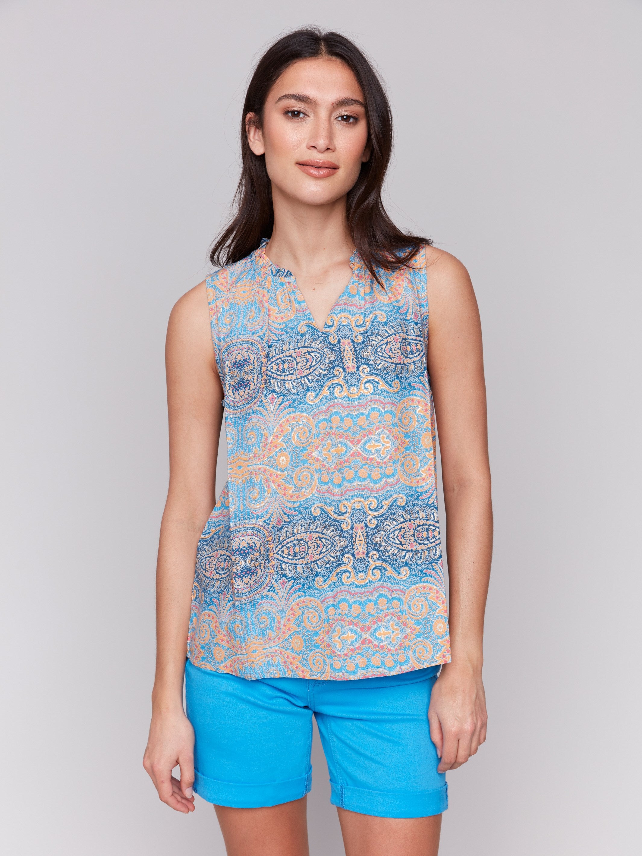 Blue and orange blouse with a V-neck opening by Charlie B.