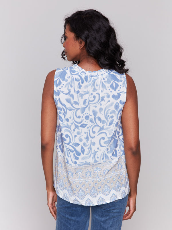 Ruffle neckline on a stylish royal blue blouse by Charlie B.