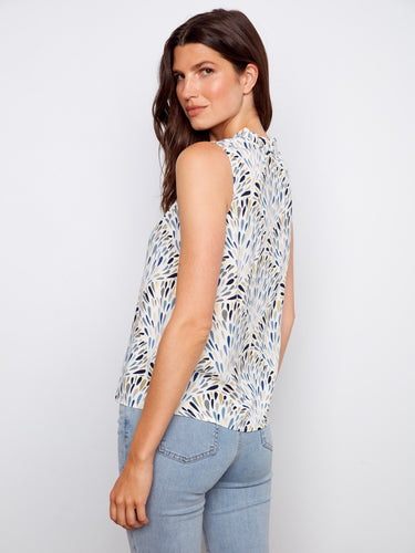 Ruffled neckline adds an elegant touch to this lightweight gardenia print top by Charlie B.