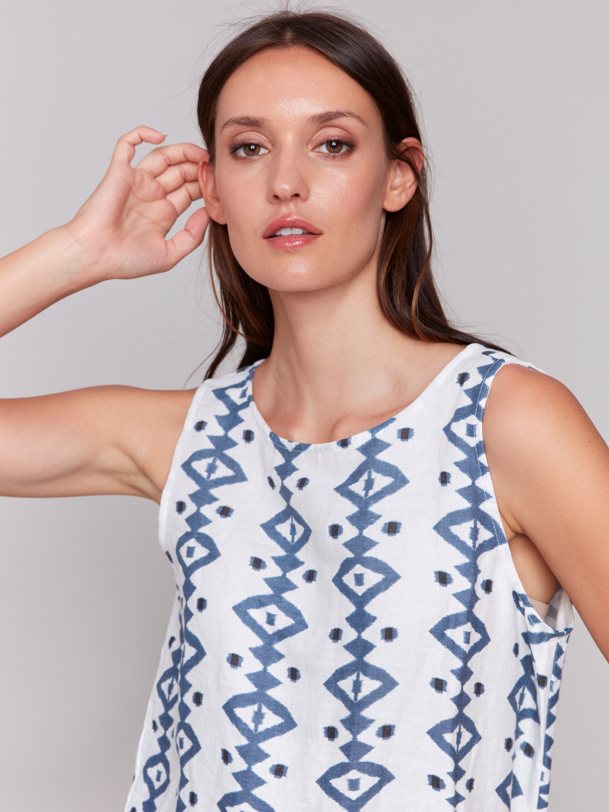 Top featuring a crew neckline and bold geometric design by Charlie B.