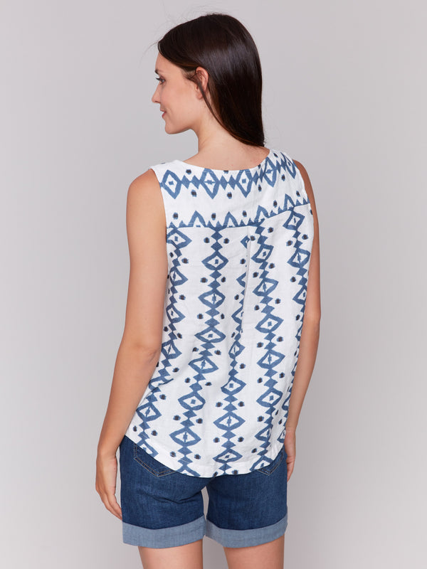 Trendy rounded hem adds flair to this printed sleeveless top by Charlie B.