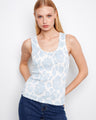 This top features a classic scoop neckline, perfect for versatile styling. The light floral pattern adds a touch of elegance by Charlie B.
