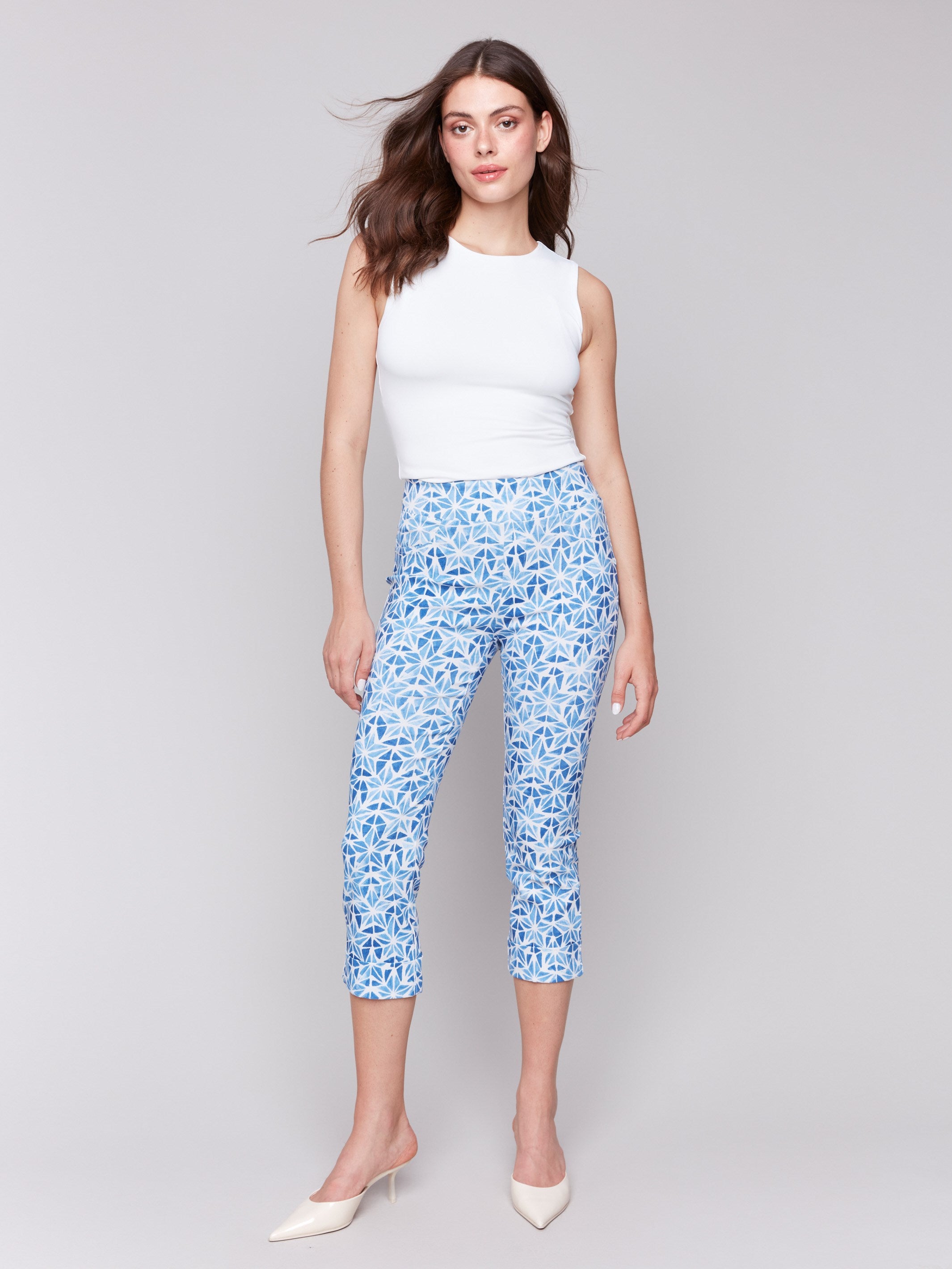 Blue capri pants with a slim leg design by Charlie B.