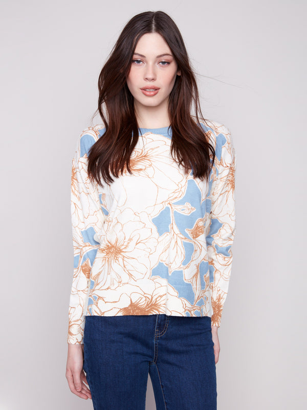 Sweater featuring a floral mist print with ribbed neck and hem for a snug fit by Charlie B.