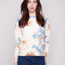 Sweater featuring a floral mist print with ribbed neck and hem for a snug fit by Charlie B.