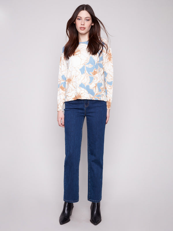 Chic floral sweater designed with long sleeves and crafted for comfort by Charlie B.