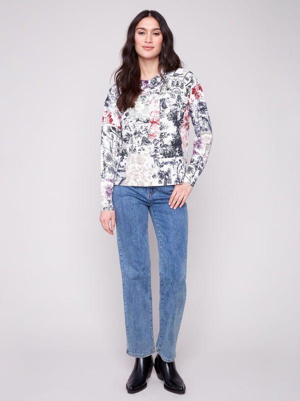 Abstract Frame print sweater with ribbed neck and hem accents, offering a chic and comfortable fit by Charlie B.