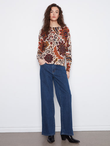 This sweater features a drop shoulder design, enhancing comfort and style. It's ideal for relaxed and fashionable looks. By Charlie B.