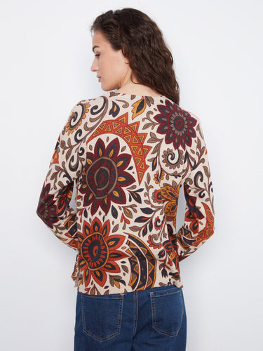 The vibrant floral print on this crew neck sweater brings life to any outfit, ensuring you stand out in style and comfort. By Charlie B.