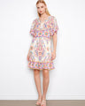Dress with abstract patterns and a smocked back waist, featuring flutter sleeves and a V-neck by Charlie B.
