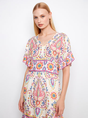 Charming dress displaying a V-neck design, intricate patterns, and flutter sleeves by Charlie B.