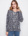 Floral top with a flattering V-neck, showcasing elegant long sleeves. Perfect for a relaxed fit look by Charlie B.