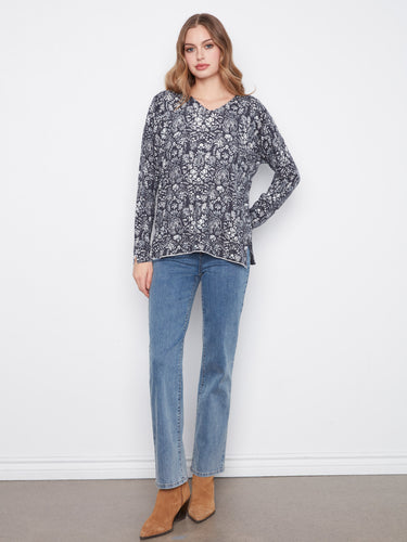 Chic floral pattern top featuring side slits at the cuffs and hem, offering both style and comfort by Charlie B.