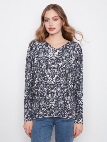Stylish V-neck floral top with long sleeves, designed for a relaxed fit that enhances casual elegance by Charlie B.
