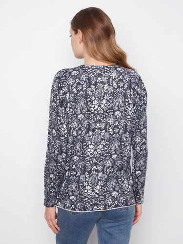 Elegant long-sleeved floral top in a relaxed fit, ideal for adding charm to any outfit effortlessly by Charlie B.