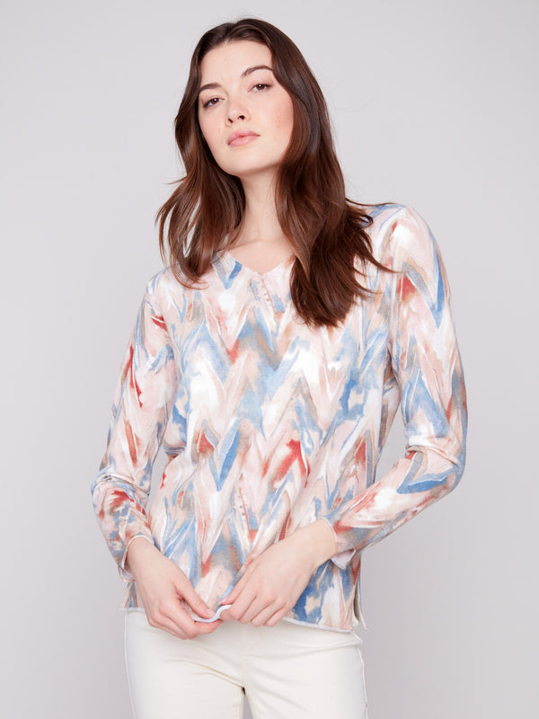 Sweater with plushy yarn texture and colorful chevron pattern, featuring long sleeves for added warmth by Charlie B.