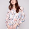 Sweater with plushy yarn texture and colorful chevron pattern, featuring long sleeves for added warmth by Charlie B.
