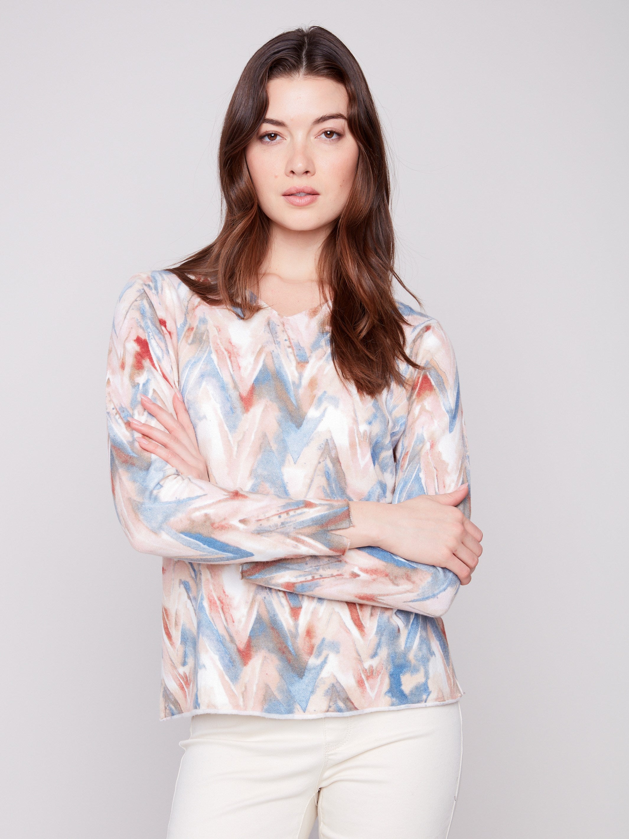 Sweater showcasing a relaxed fit with a vibrant chevron design, perfect for casual comfort by Charlie B.