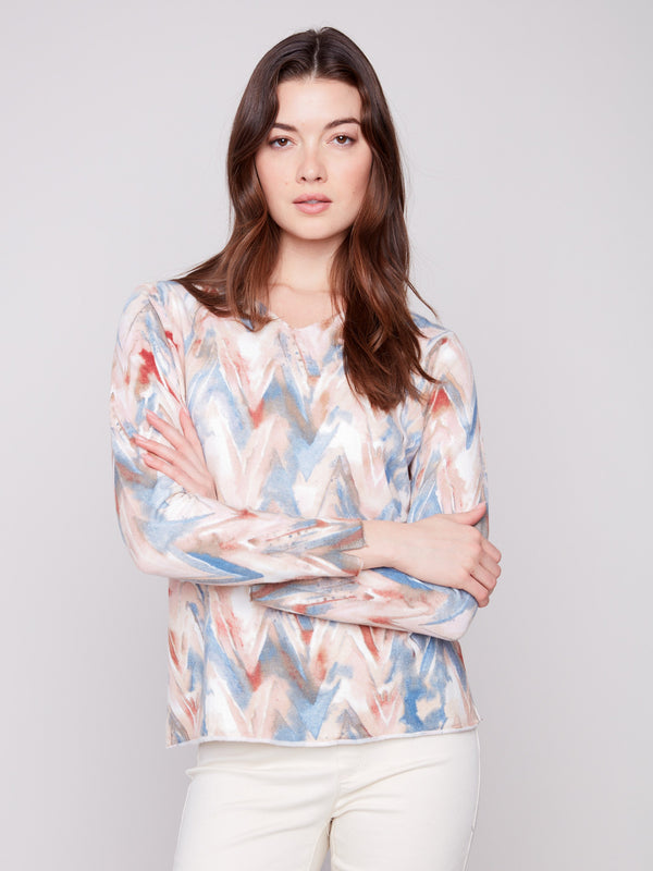 Sweater showcasing a relaxed fit with a vibrant chevron design, perfect for casual comfort by Charlie B.